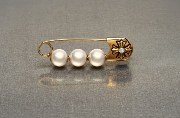 Pearl jewelry styled with gothic metal details, safety pins and layered chains for a modern punk-inspired look.