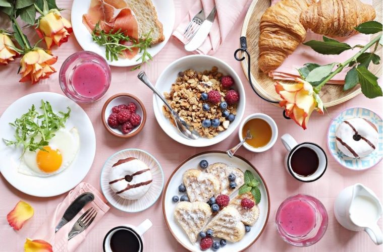 Healthy and less healthy foods alongside everyday lifestyle choices that can influence cholesterol and heart health.