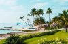Luxury Caribbean resort overlooking turquoise water with tropical beaches and lush island scenery.