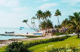 Luxury Caribbean resort overlooking turquoise water with tropical beaches and lush island scenery.