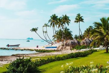 Luxury Caribbean resort overlooking turquoise water with tropical beaches and lush island scenery.