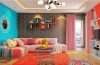 A stylish room featuring a creative DIY painted wall with bold geometric shapes and complementary colors.