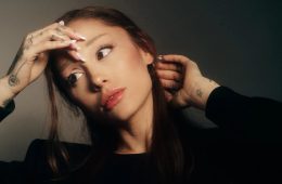 Ariana Grande in promotional artwork for her album Petal, highlighting the singer's reflective new musical era.