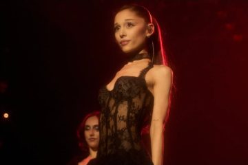 Ariana Grande attends a public event as fans discuss her recent Instagram activity and message about personal growth.