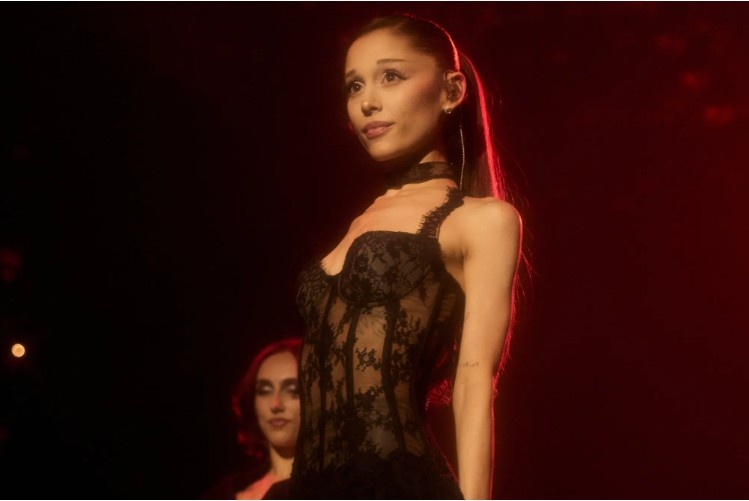 Ariana Grande attends a public event as fans discuss her recent Instagram activity and message about personal growth.