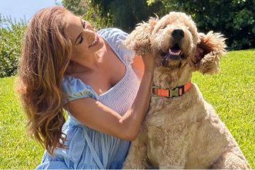 Ryan Gosling and Eva Mendes with their newly adopted rescue dog, celebrating the newest addition to their family.