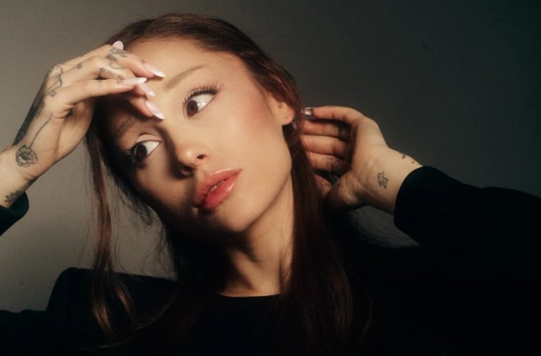 Ariana Grande in promotional artwork for her album Petal, highlighting the singer's reflective new musical era.