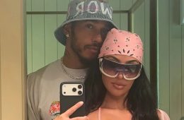 Kim Kardashian and Lewis Hamilton embrace during a tropical vacation while Kardashian’s family enjoys the getaway.