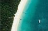 Aerial view of Whitehaven Beach in Australia with brilliant white silica sand and turquoise water.
