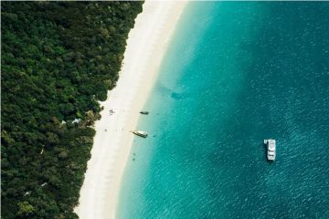 Aerial view of Whitehaven Beach in Australia with brilliant white silica sand and turquoise water.