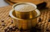 Traditional South Indian filter coffee served in a stainless-steel tumbler and dabara with frothy milk coffee.