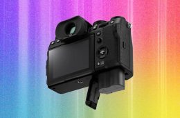 Photographer comparing cameras and lenses while choosing the right camera for photography.
