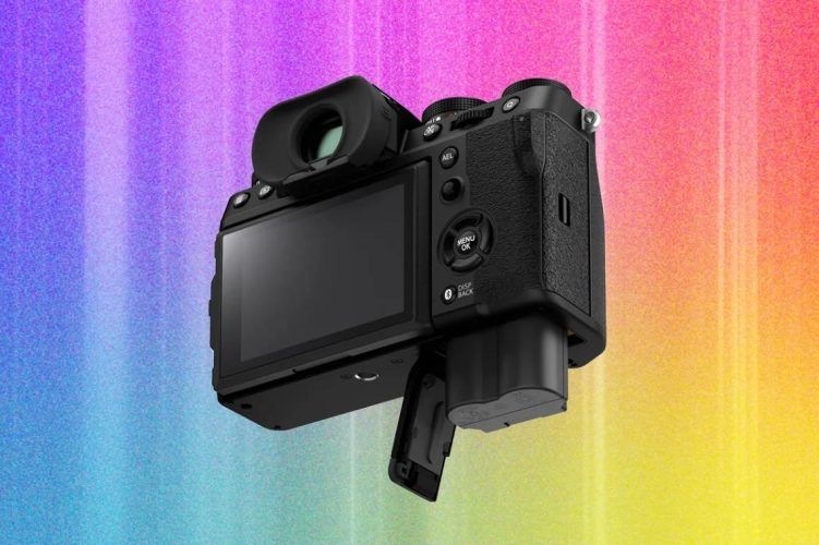 Photographer comparing cameras and lenses while choosing the right camera for photography.