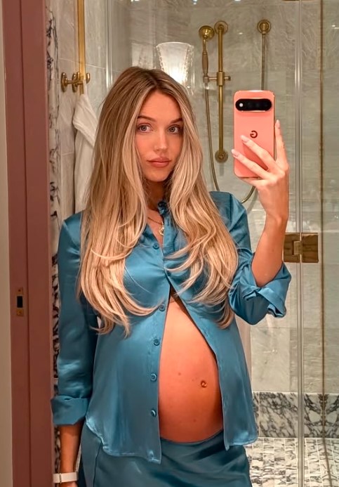 Alex Cooper Shows Off Her Baby Bump in New York City as She Says There’s “Lotssss of Pink & Blue These Days”