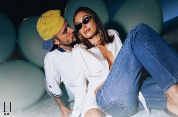 Justin and Hailey Bieber sharing a kiss for their WYouth magazine cover