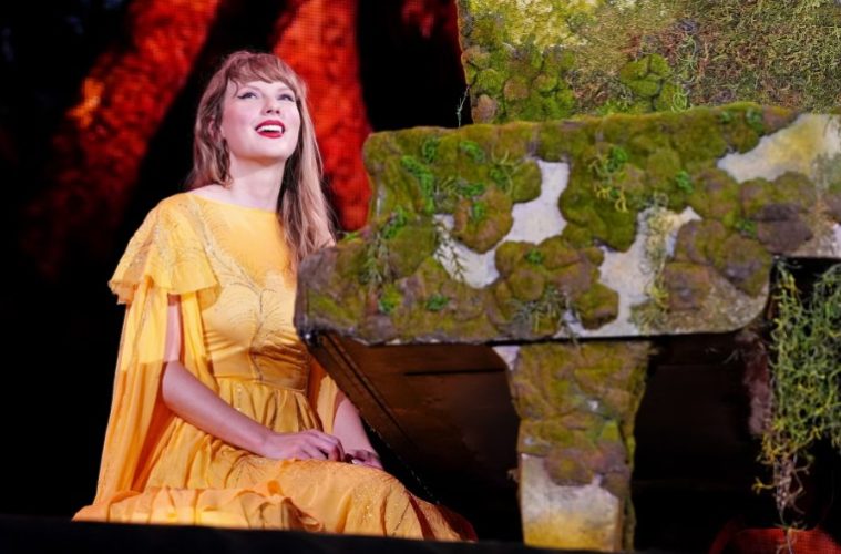 Taylor Swift poses during a public appearance as she promotes her new song written for the animated film Toy Story 5.