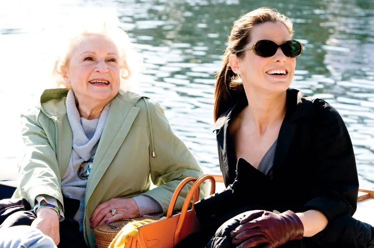 Sandra Bullock and Betty White share a lighthearted moment in a still from The Proposal.