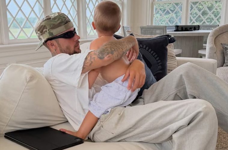 Justin Bieber smiles alongside his young son Jack in a recently shared family photo from the singer's Instagram.