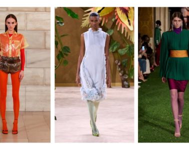 A model wears vibrant red tights with a coordinated fashion look, showcasing the colorful hosiery trend emerging for fall 2026.