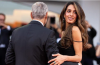 Amal Clooney shows off a short, glossy pink manicure while appearing on the Venice Film Festival red carpet.