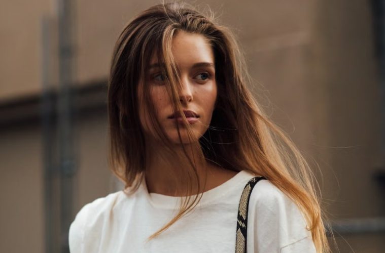 A selection of lightweight conditioners for fine hair arranged beside soft, voluminous strands styled to look fuller and healthier.