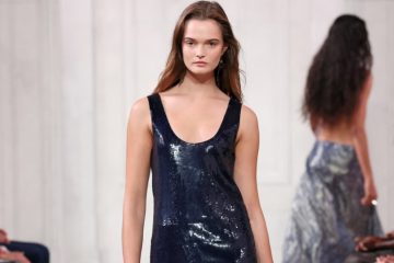 A Ralph Lauren Spring 2027 runway look combines polished tailoring with romantic details during the designer’s New York Fashion Week presentation.