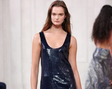 A Ralph Lauren Spring 2027 runway look combines polished tailoring with romantic details during the designer’s New York Fashion Week presentation.