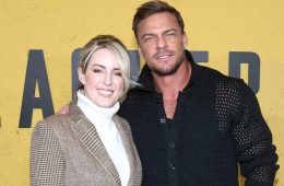 Alan Ritchson and Catherine Ritchson pose together at a public event before announcing their separation after 20 years of marriage.