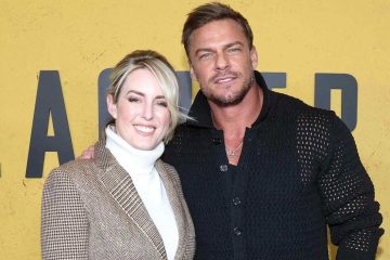 Alan Ritchson and Catherine Ritchson pose together at a public event before announcing their separation after 20 years of marriage.