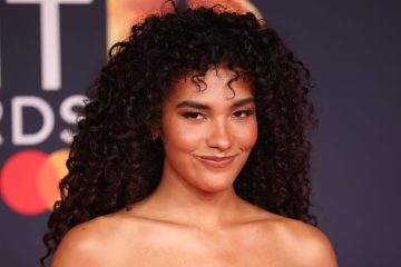 A woman with defined curly hair demonstrates a moisture-layering routine designed to enhance hydration, shine, softness, and natural curl definition.