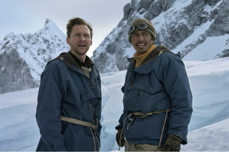 Genden Phuntsok and Tom Hiddleston appear as Tenzing Norgay and Edmund Hillary in a snow-covered scene from the film Tenzing.